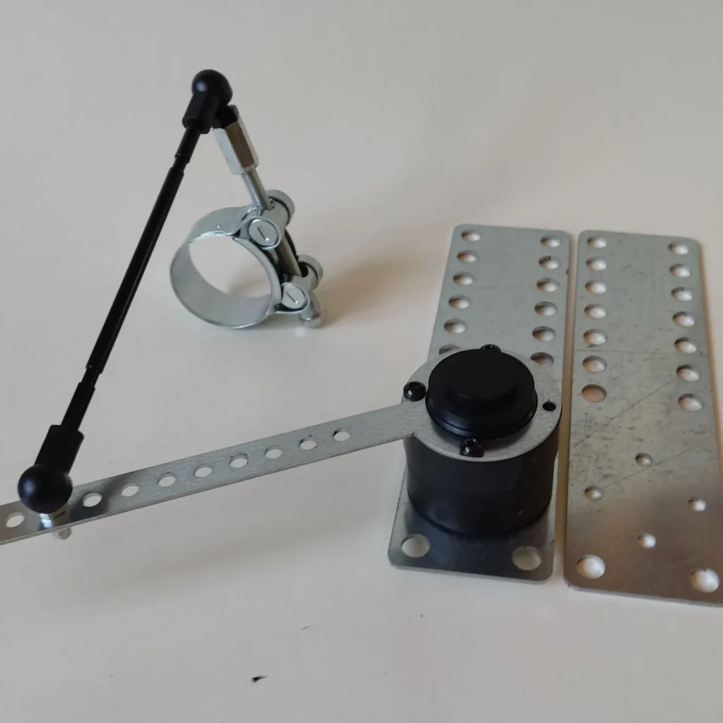 Delphi wheel angle sensor with linkage rod, clamp and perforated mounting plates