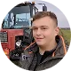 Portrait of an AgOpen customer next to his tractor